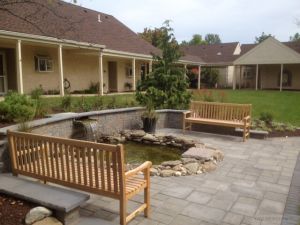 Teak Block Island Benches in Retirement Comm - Cust Photo Goldenteak